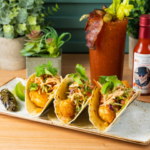 Crispy Cajun spiced snapper, pico de gallo, cabbage, fresh lime, cilantro, avocado, red chili crème, charred fresh jalapeño